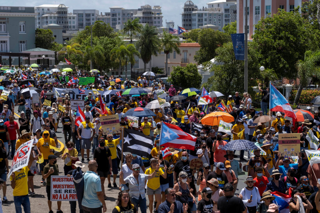 Demonstrators protest to demand the cancellation of electricity grid operator LUMA Energy contract outside the governor’s mansion La Fortaleza in San Juan, Puerto Rico July 20, 2022.